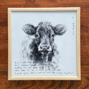 Home framed charcoal cow and text print
